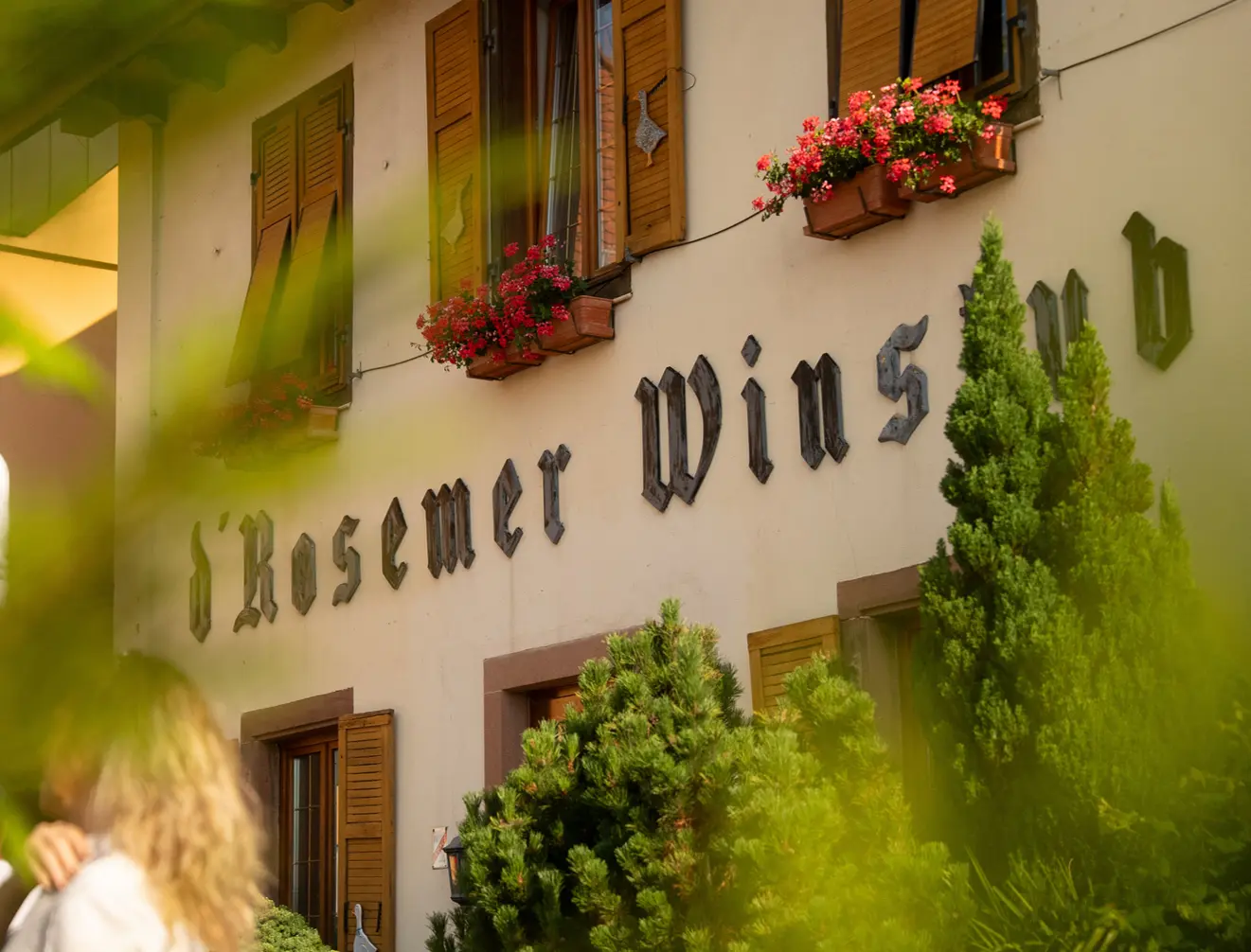 Rosemer Winstub facade with geraniums in the windows